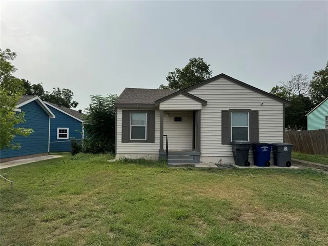 front view of a house with a yard