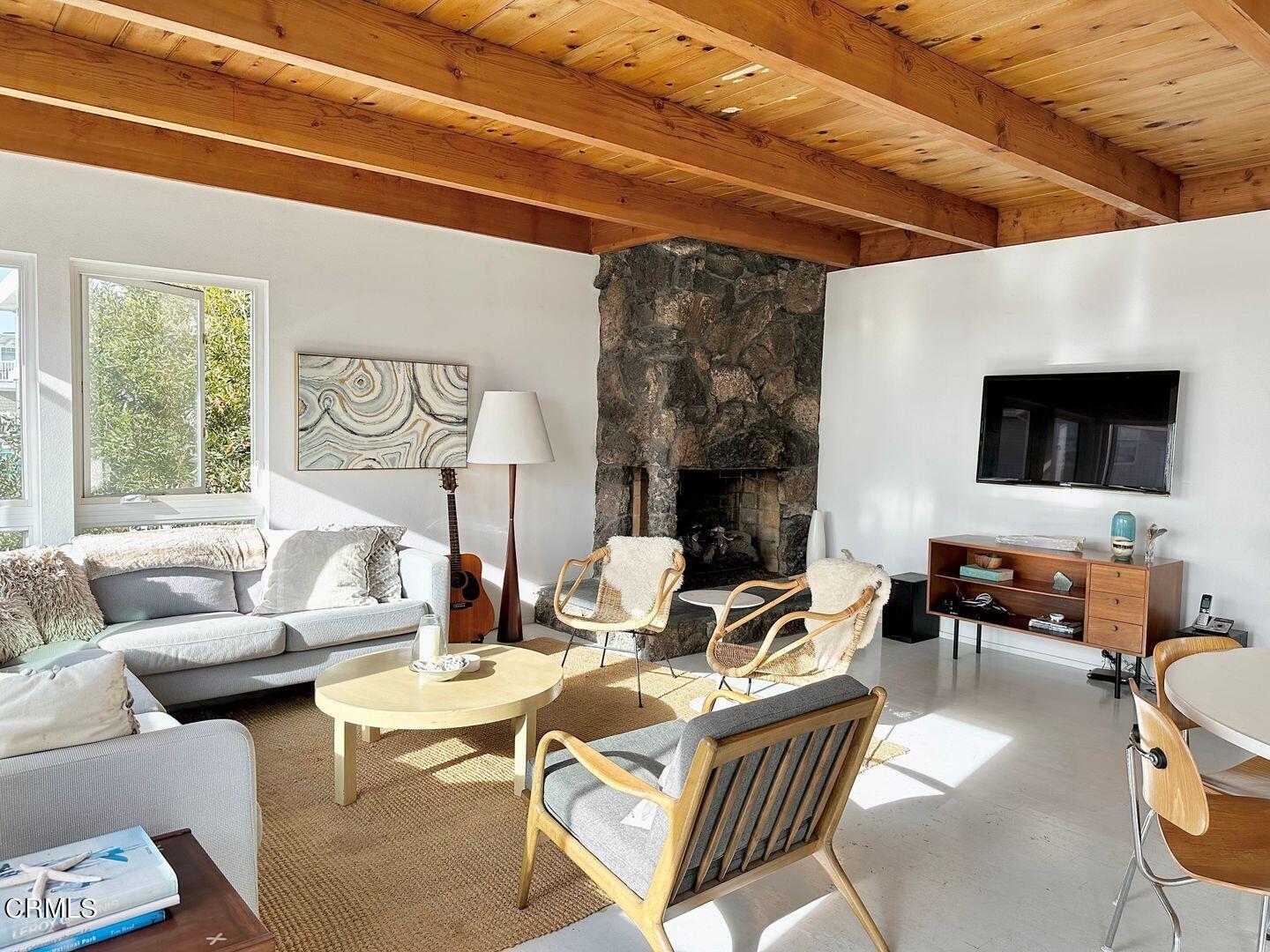 3600 Ocean Drive Oxnard, CA 93035 - Photo 12 of 36 a living room with fireplace furniture and a flat screen tv