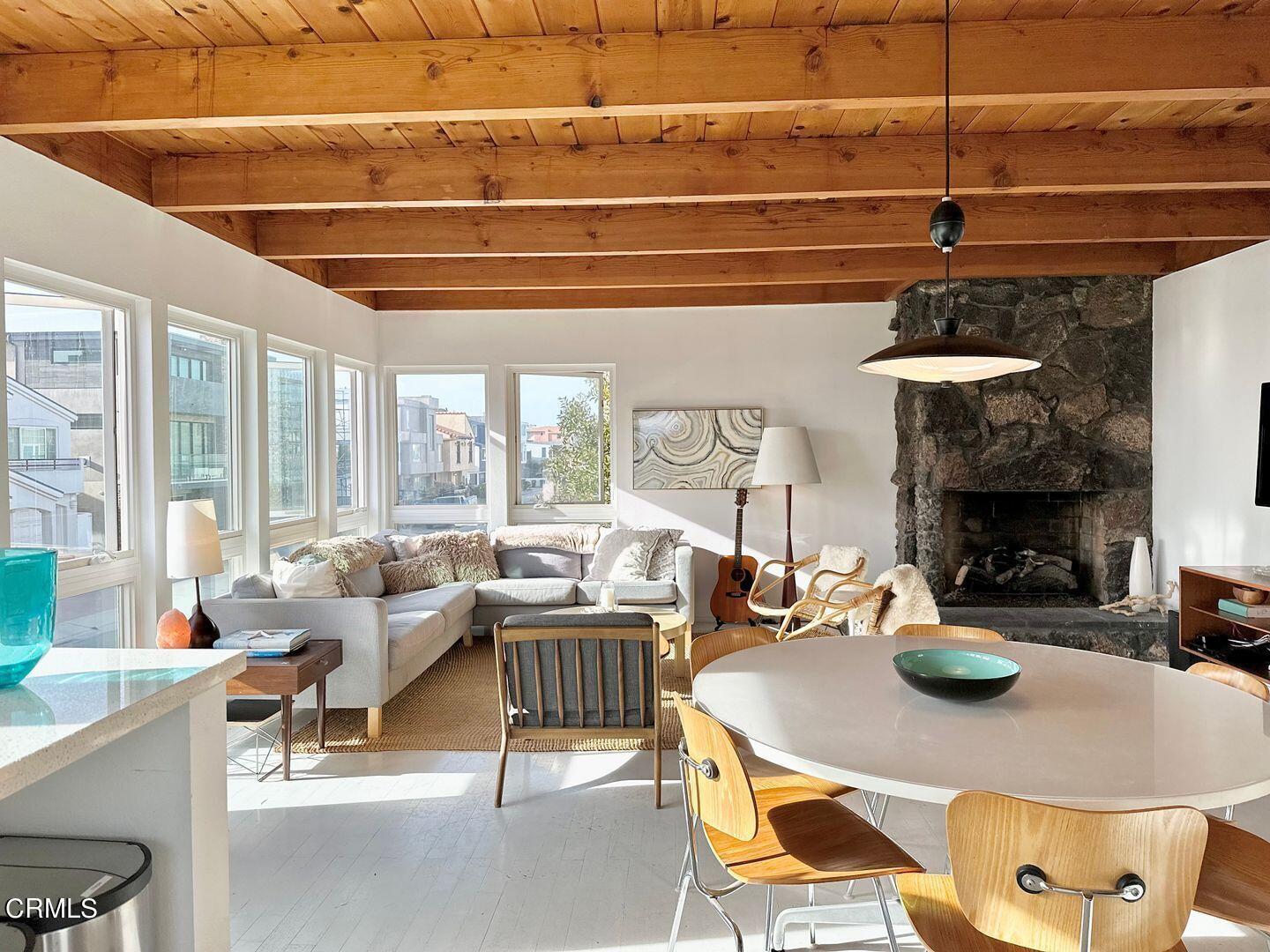 3600 Ocean Drive Oxnard, CA 93035 - Photo 13 of 36 a living room with fireplace furniture and a large window