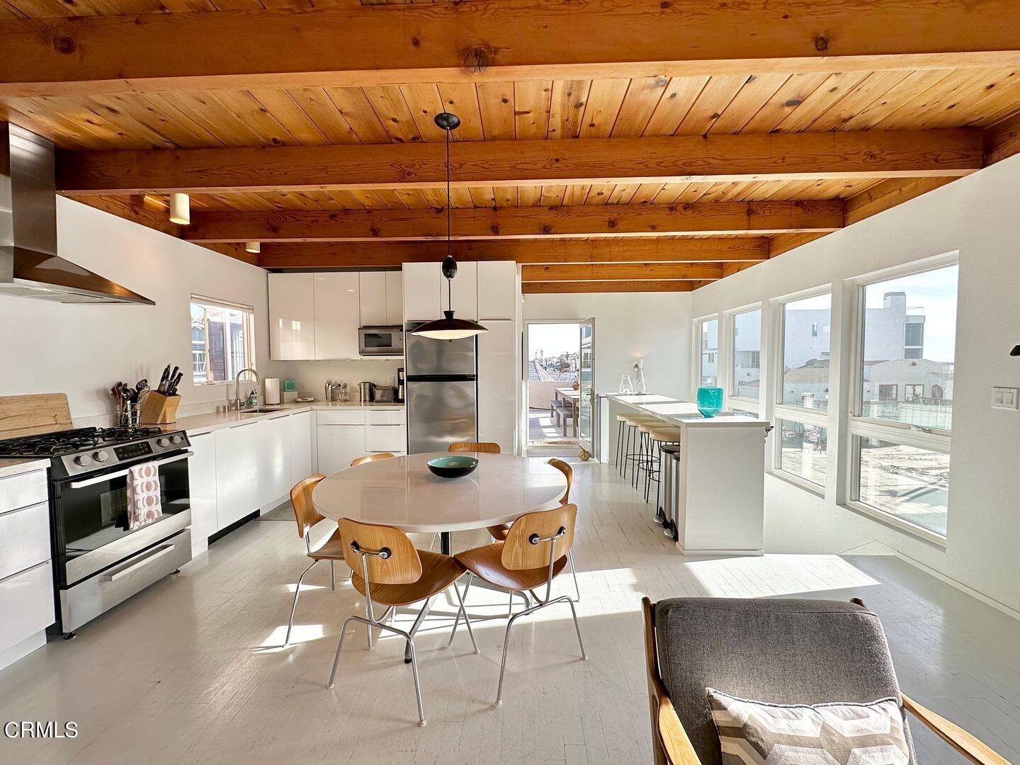3600 Ocean Drive Oxnard, CA 93035 - Photo 15 of 36 a kitchen with a stove and white cabinets