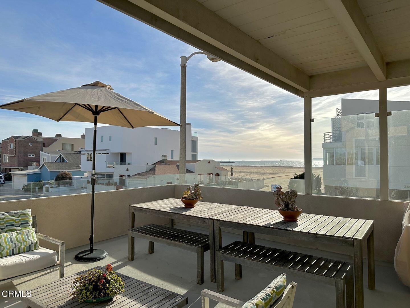 3600 Ocean Drive Oxnard, CA 93035 - Photo 2 of 36 a dining room with furniture and a floor to ceiling window