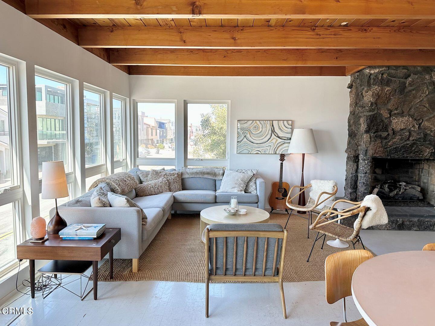 3600 Ocean Drive Oxnard, CA 93035 - Photo 3 of 36 a living room with furniture and a floor to ceiling window