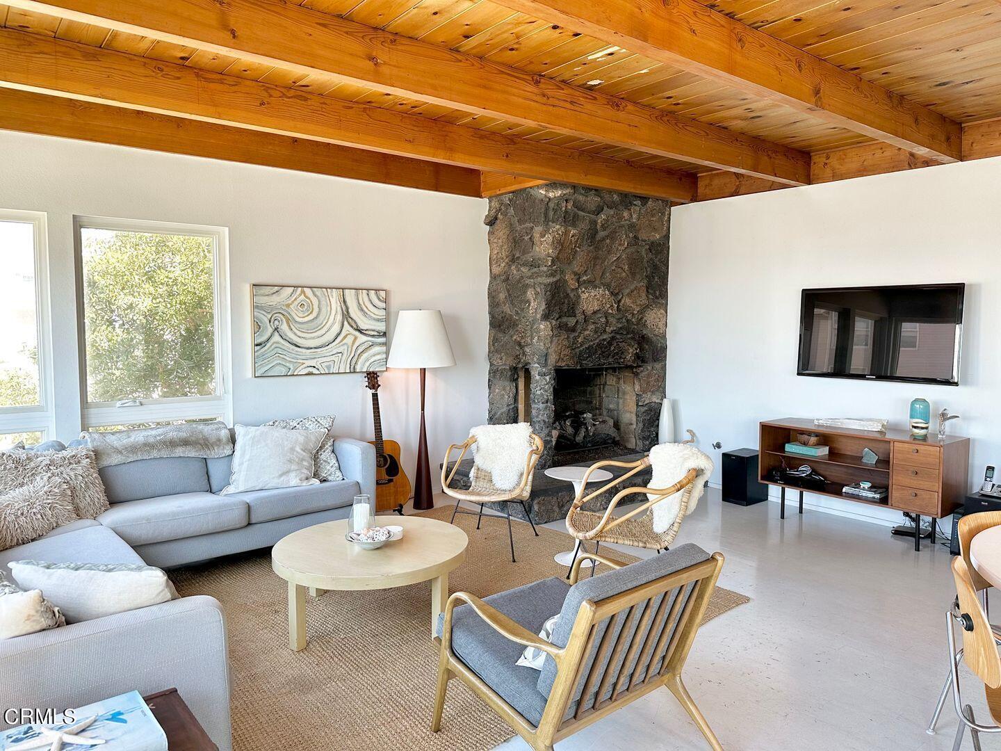 3600 Ocean Drive Oxnard, CA 93035 - Photo 4 of 36 a living room with furniture and a fireplace