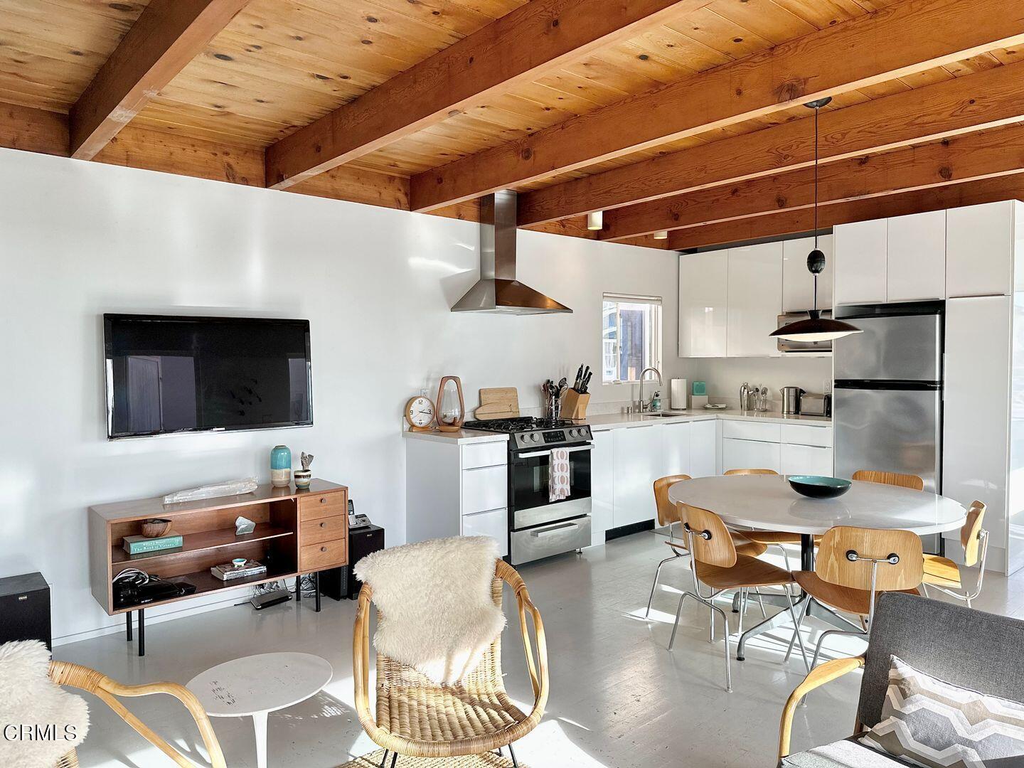 3600 Ocean Drive Oxnard, CA 93035 - Photo 9 of 36 a living room with furniture and flat screen tv