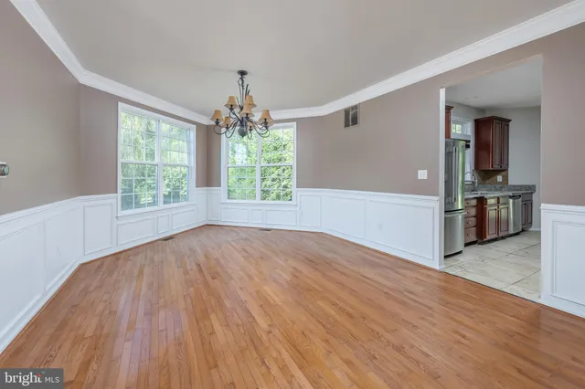 a kitchen with stainless steel appliances granite countertop a stove top oven a sink dishwasher and cabinets
