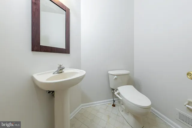 a kitchen with a sink a table and chairs