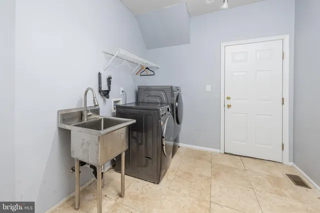 a view of a living room with wooden floor and furniture