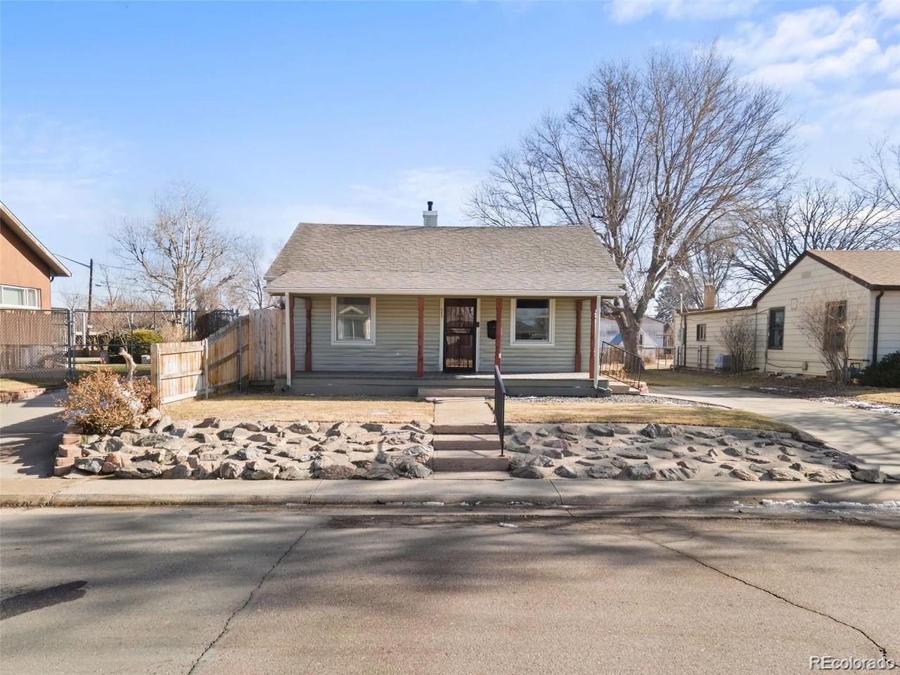 a front view of a house with a trees