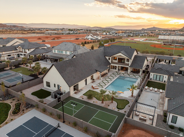 2281 South Crimson Cliffs Way St. George, UT 84790 - Photo 5 of 47 Aerial view of residential area with a pool and mountains