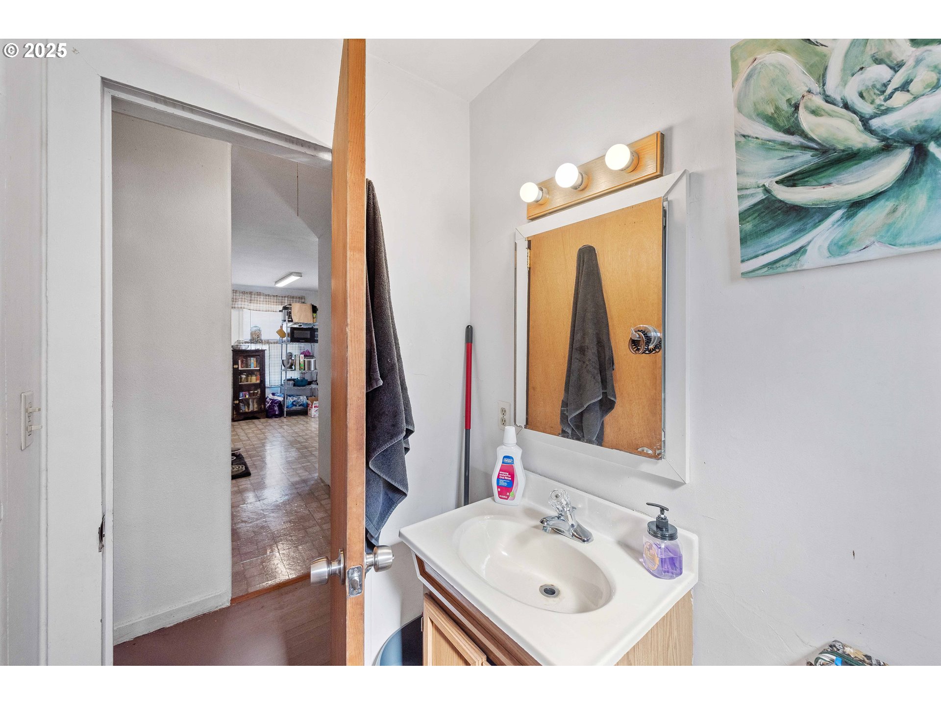 805 C Street Myrtle Point, OR 97458 - Photo 12 of 30 a bathroom with a sink vanity and a mirror