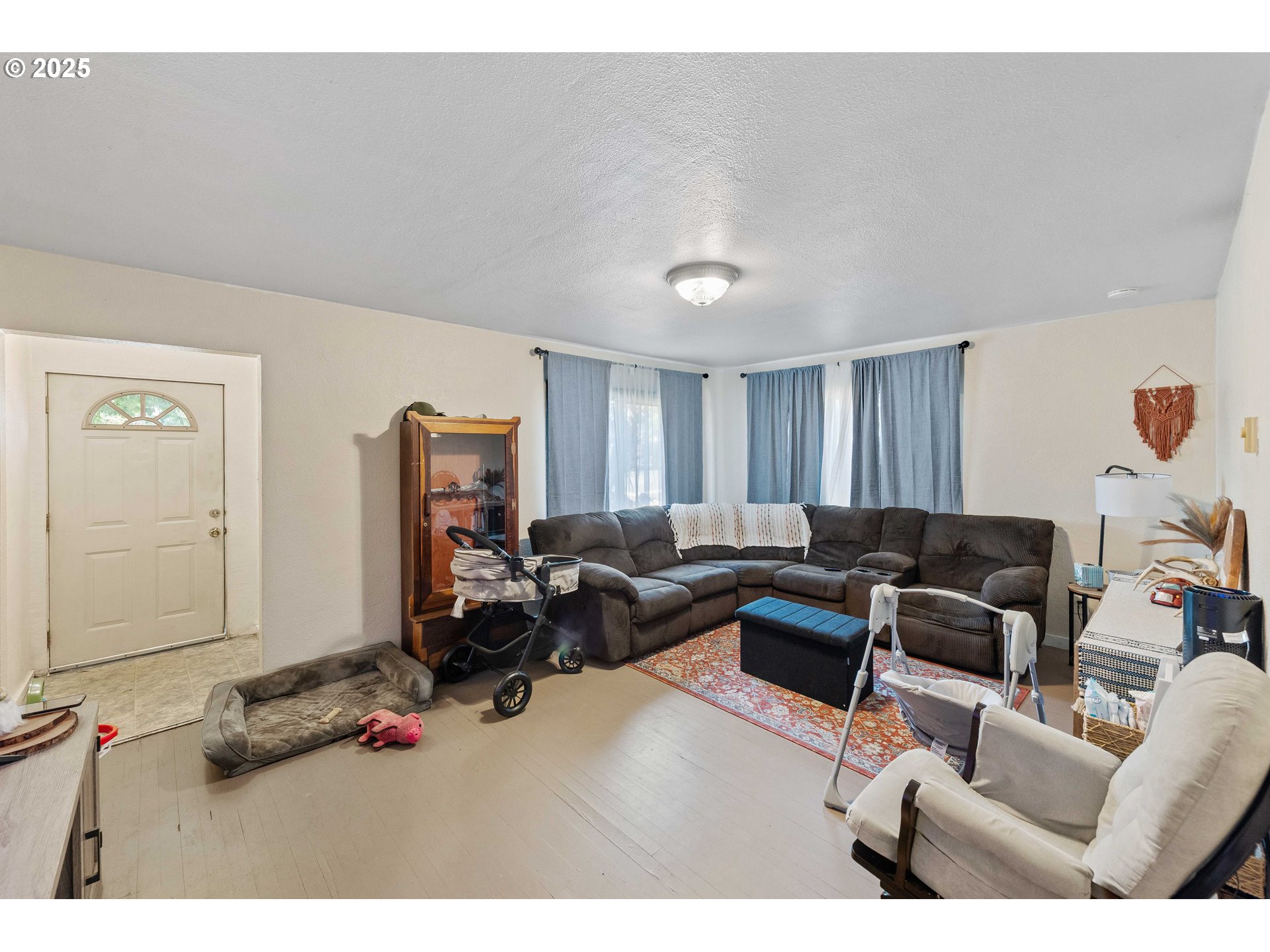 805 C Street Myrtle Point, OR 97458 - Photo 13 of 30 a living room with furniture a window and a wooden floor