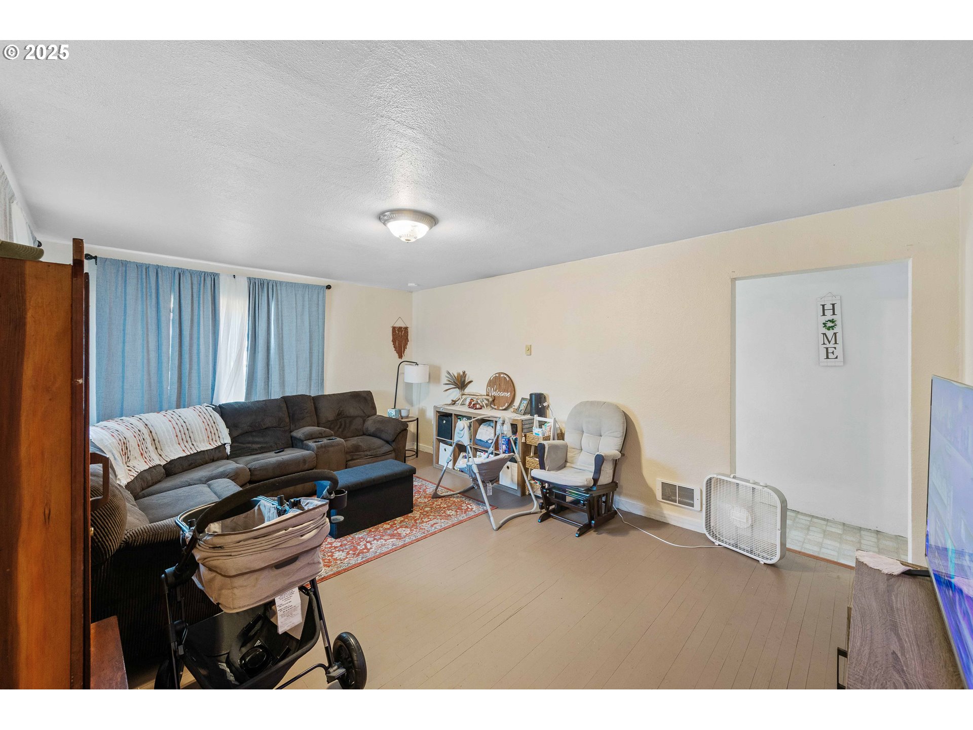 805 C Street Myrtle Point, OR 97458 - Photo 14 of 30 a living room with furniture and a couch