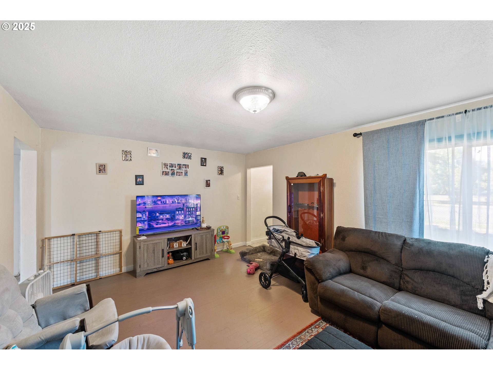 805 C Street Myrtle Point, OR 97458 - Photo 15 of 30 a living room with furniture and a flat screen tv