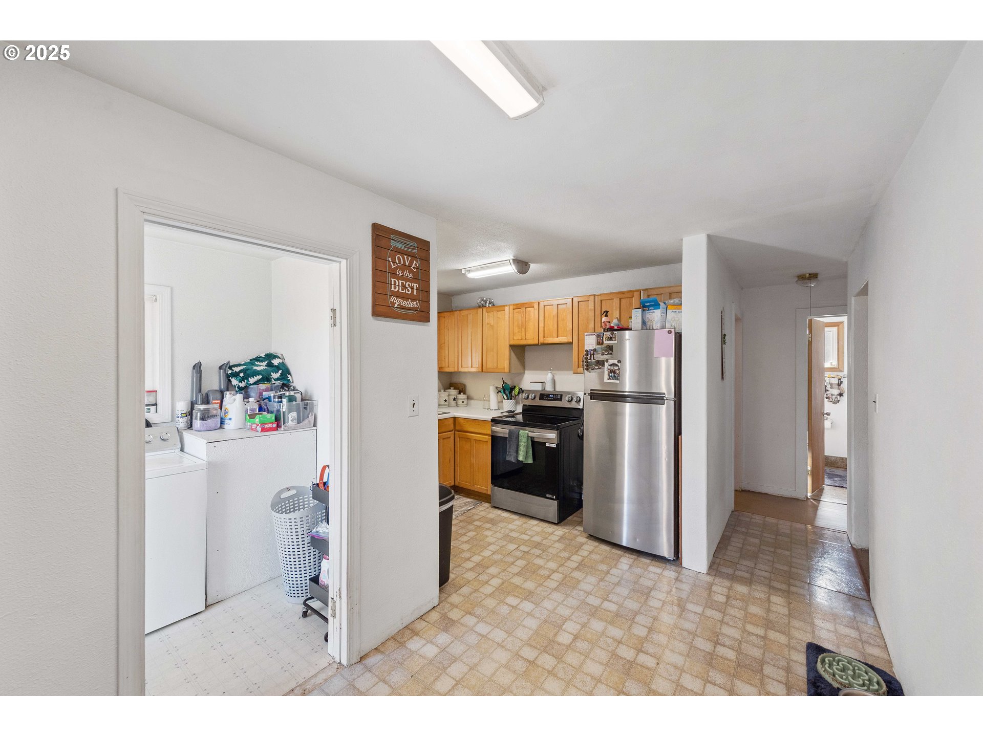 805 C Street Myrtle Point, OR 97458 - Photo 17 of 30 a kitchen with stainless steel appliances a refrigerator and a stove