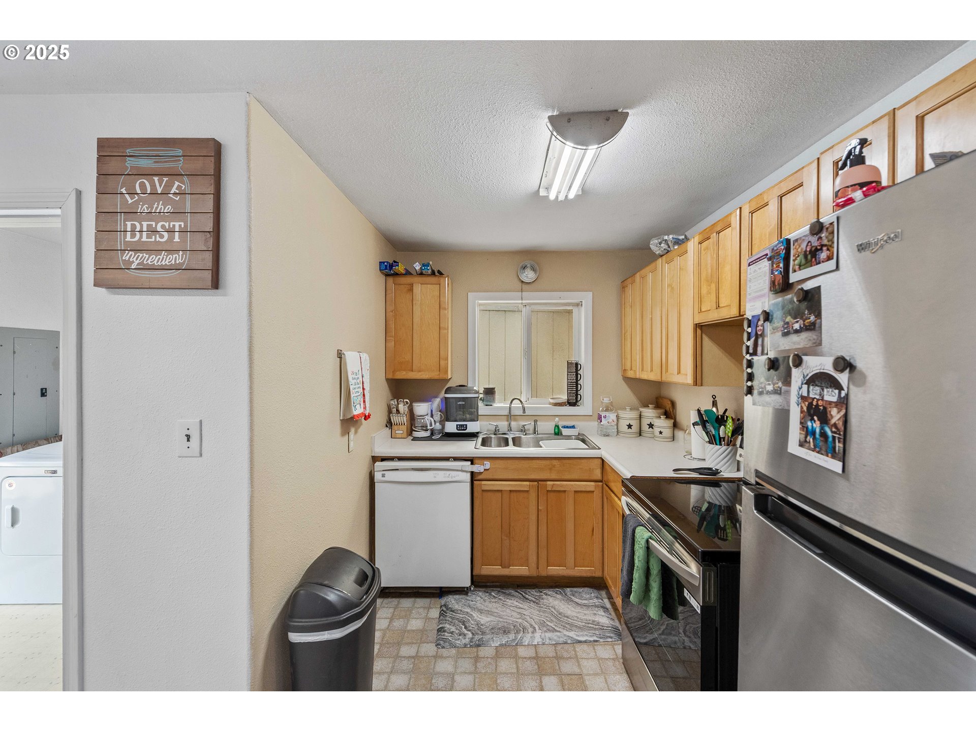 805 C Street Myrtle Point, OR 97458 - Photo 18 of 30 a kitchen with a sink a stove a refrigerator and cabinets