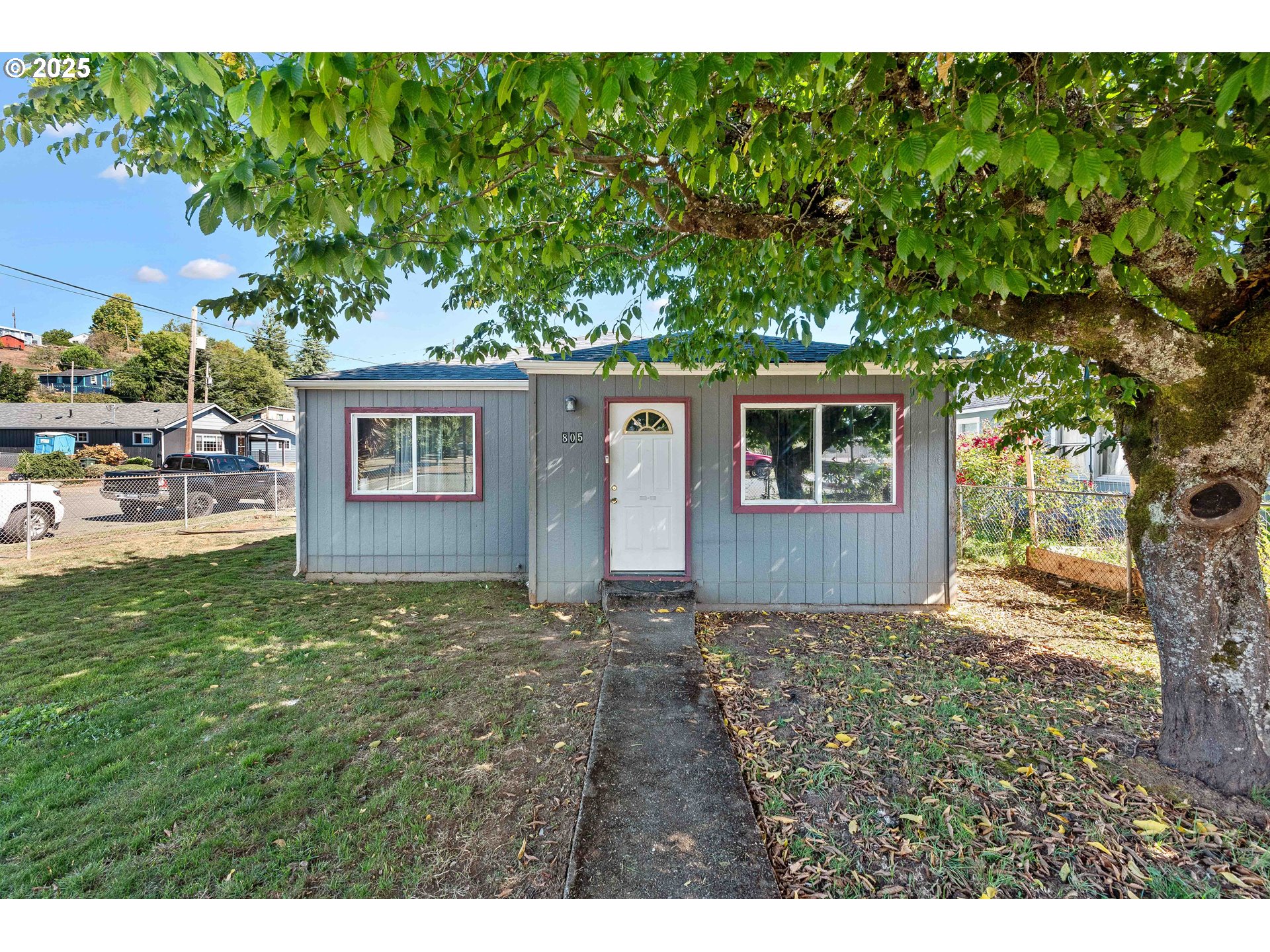 805 C Street Myrtle Point, OR 97458 - Photo 25 of 30 a view of backyard of a house