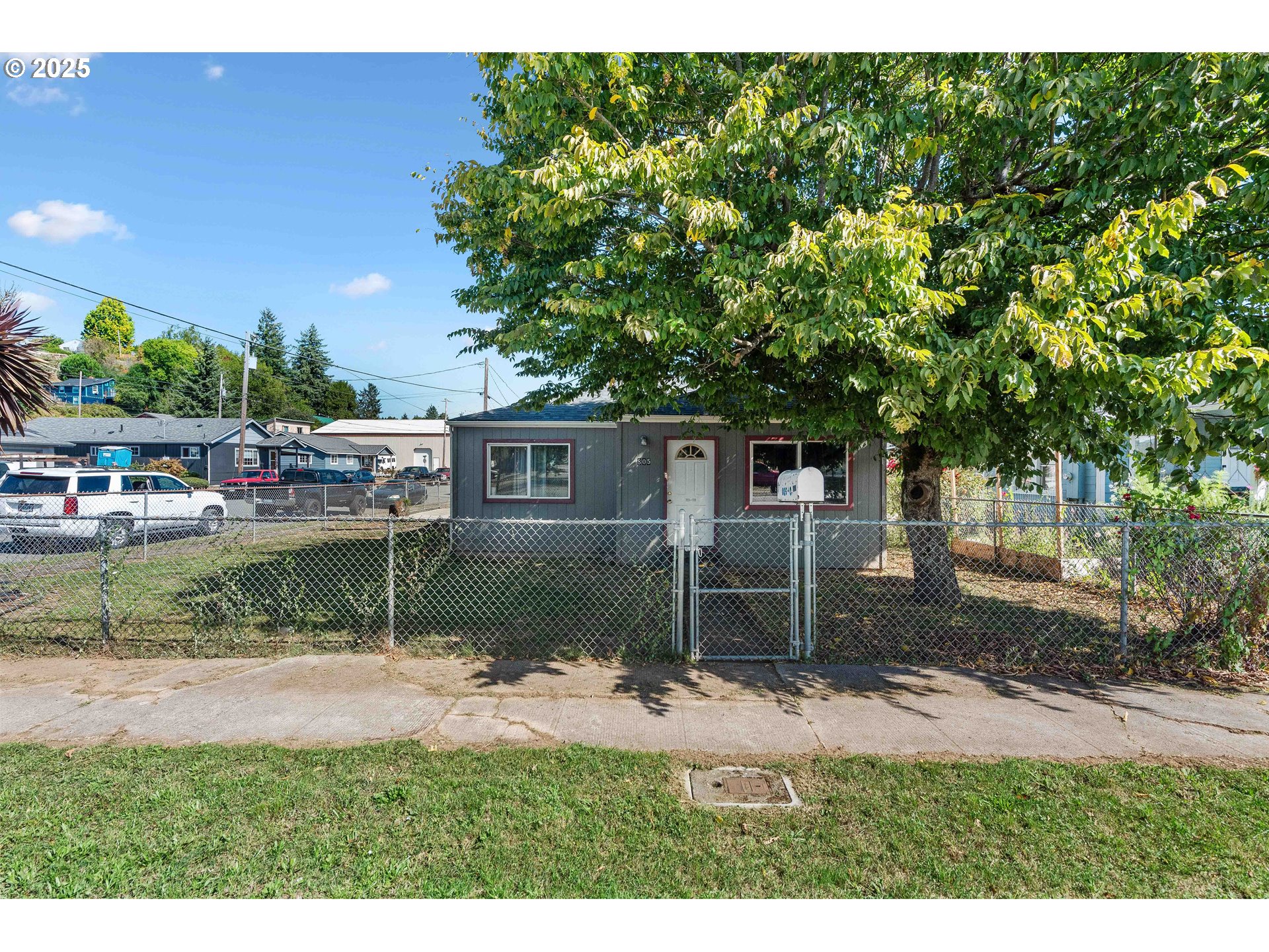805 C Street Myrtle Point, OR 97458 - Photo 30 of 30 a backyard of a house with barbeque oven table and chairs