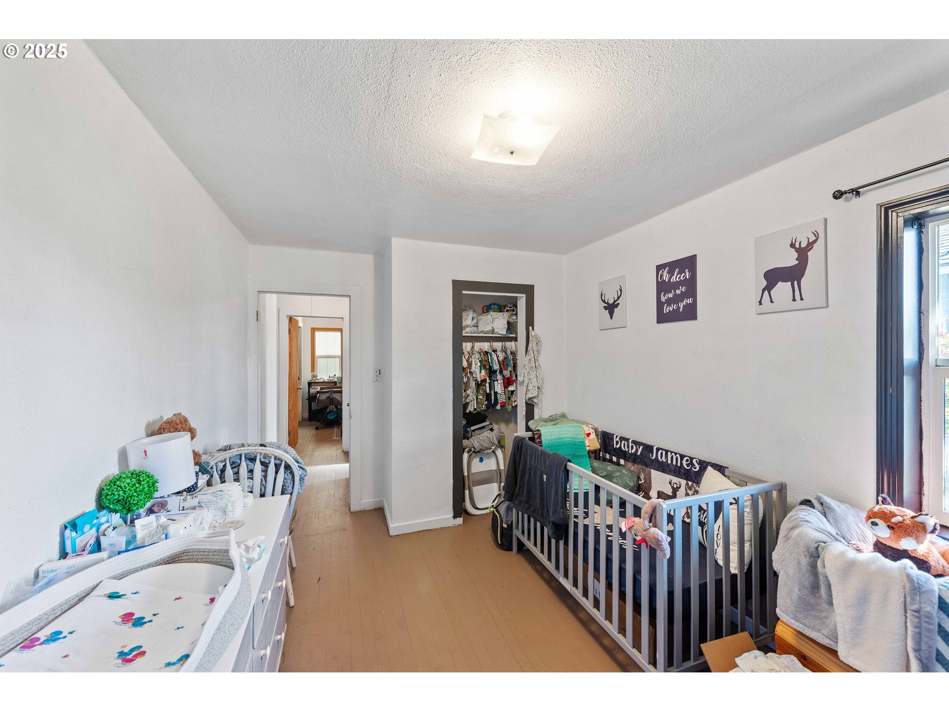 805 C Street Myrtle Point, OR 97458 - Photo 6 of 30 a bedroom with furniture and wooden floor