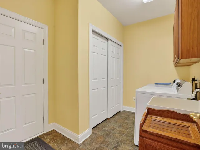 a view of a bathroom with sink and mirror