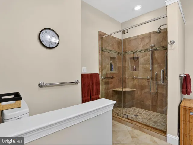 a bathroom with a shower sink and mirror