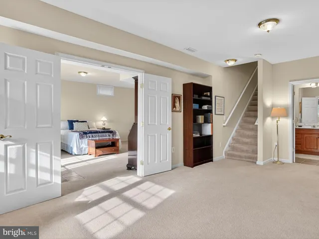a view of a livingroom with furniture and stairs