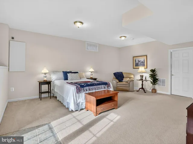 a living room with furniture and a lamp