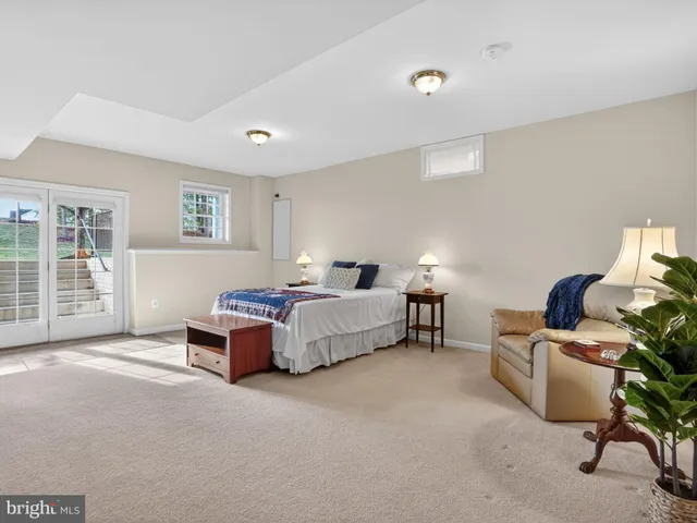 a front view of a house with a yard and outdoor seating