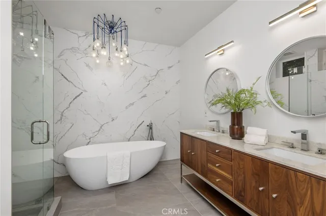 a white tub sitting next to a white sink