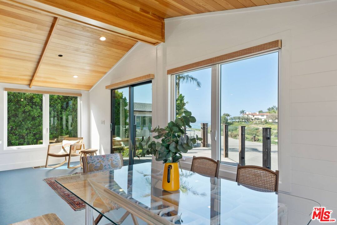 249 Paradise Cove Road Malibu, CA 90265 - Photo 7 of 41 a living room with furniture and large windows