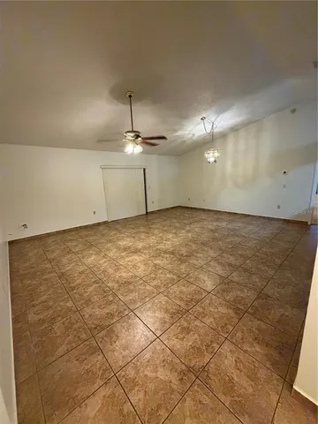 an empty room with a kitchen