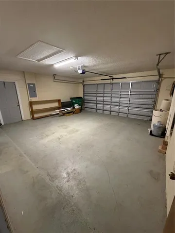 a view of a room with furniture and a ceiling fan
