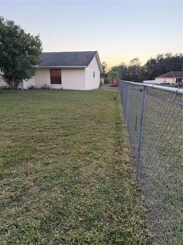 a view of a terrace with yard and mountain view in back