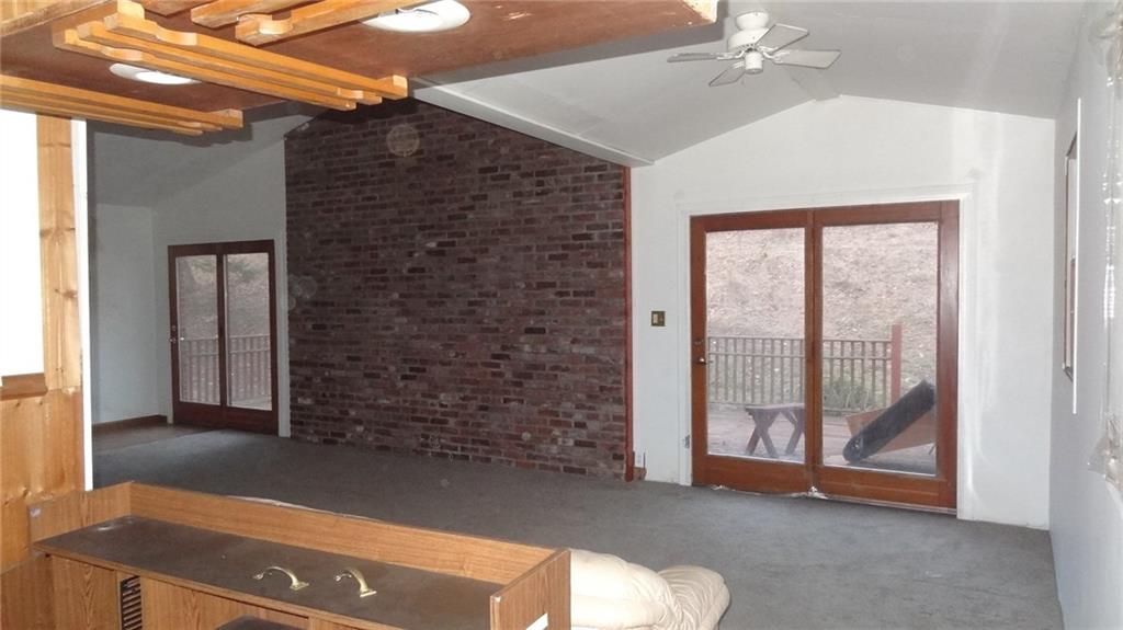 201 Weber Road Sewickley, PA 15143 - Photo 10 of 16 Upstairs of the second floor, open floor plan with bar area. Large deck with wooded view