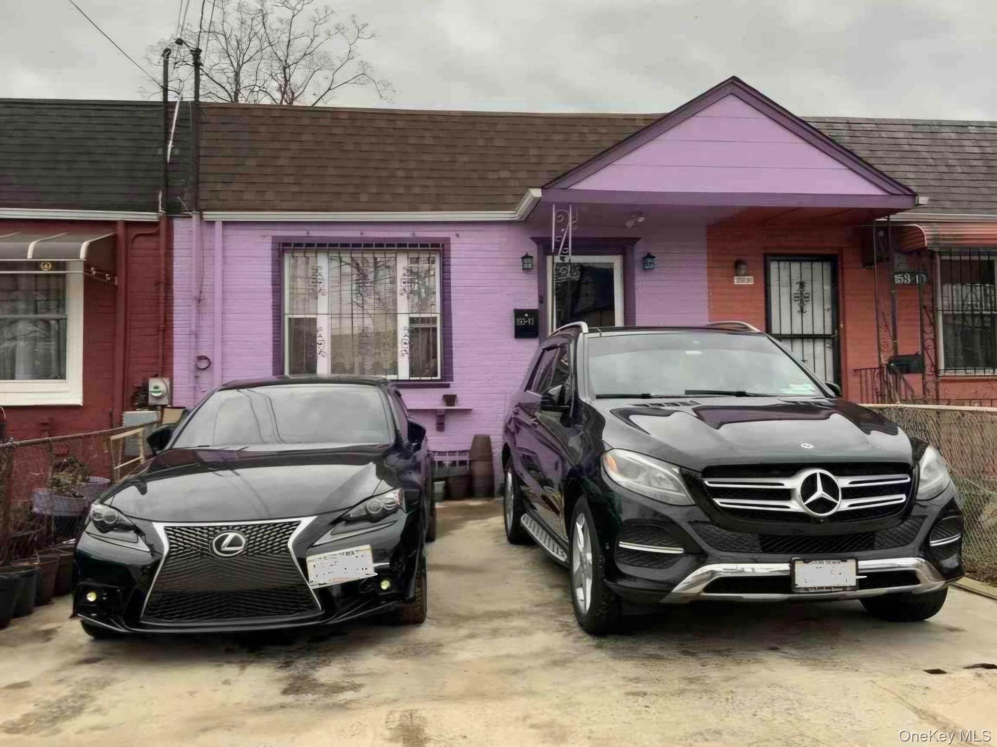 153-12 111th Road Queens, NY 11433 - Photo 1 of 1 Bungalow-style house with roof with shingles and brick siding