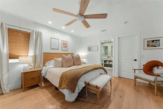 a bedroom with a bed and a cabinets