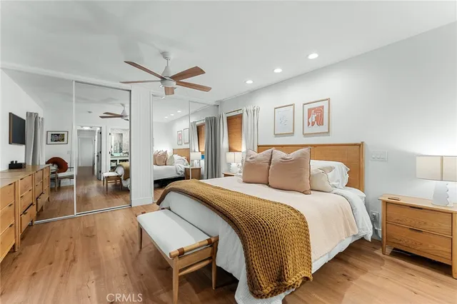 a spacious bedroom with a bed and a desk