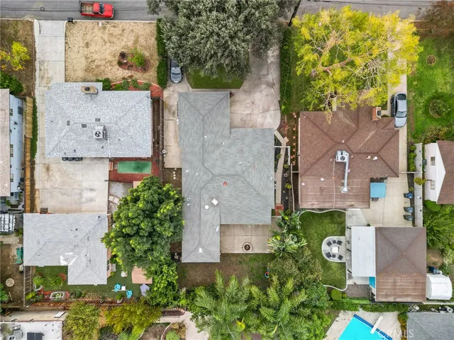 an aerial view of residential houses with outdoor space
