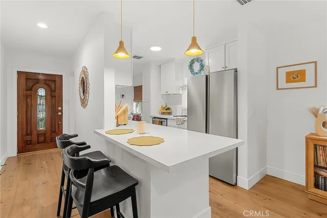 a kitchen with a table and chairs