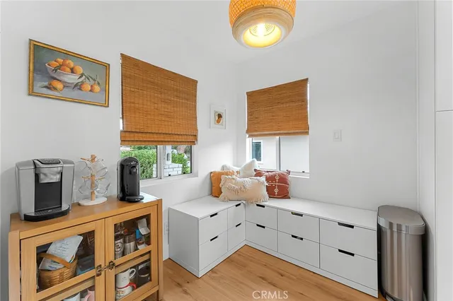 a kitchen with stainless steel appliances granite countertop a stove a sink dishwasher and microwave with wooden floor