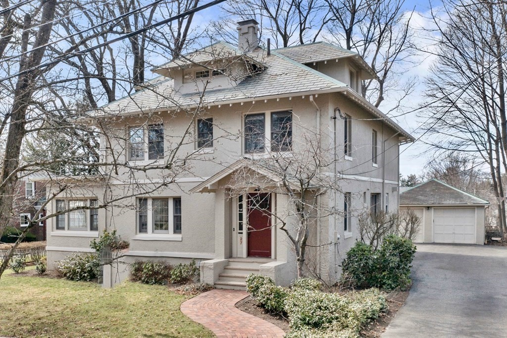 a front view of a house with garden