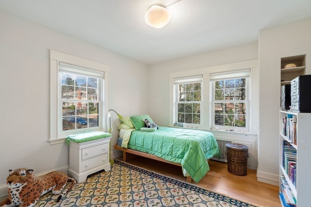 27 Nobscot Road Newton, MA 02459 - Photo 15 of 25 a bedroom with a bed and wooden floor