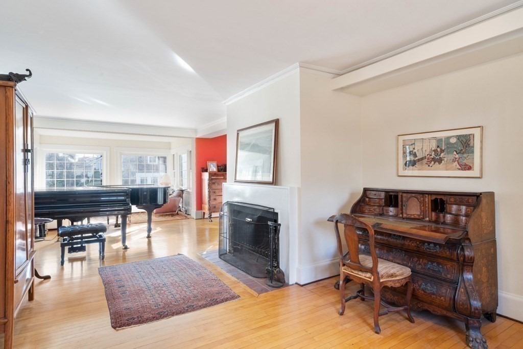 27 Nobscot Road Newton, MA 02459 - Photo 7 of 25 a living room with furniture a piano and a fireplace