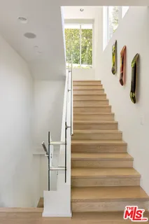 a view of a living room and floor to ceiling window or couch