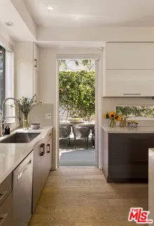 a patio with table and chairs