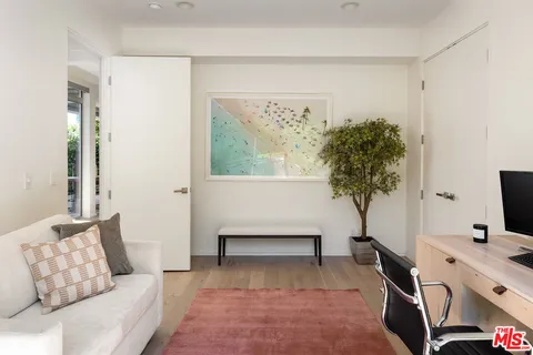 a bathroom with a sink a toilet a mirror and shower