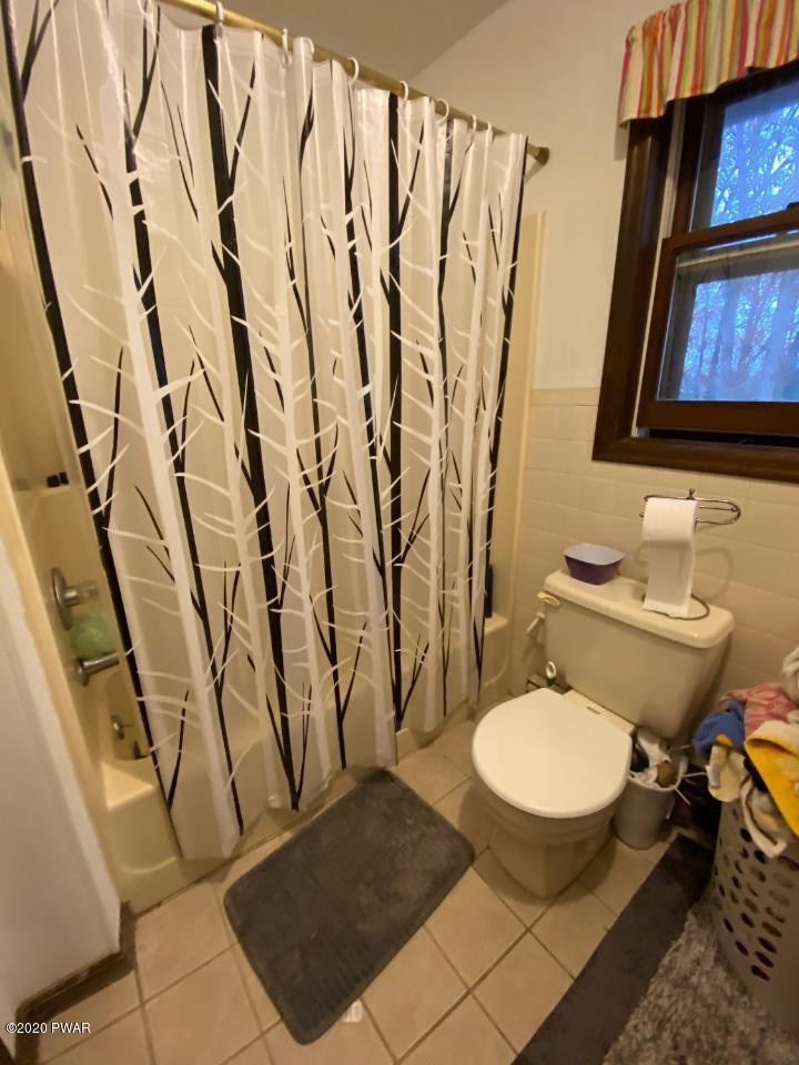 179 Butternut Road Milford, PA 18337 - Photo 20 of 39 a bathroom with a toilet sink and mirror