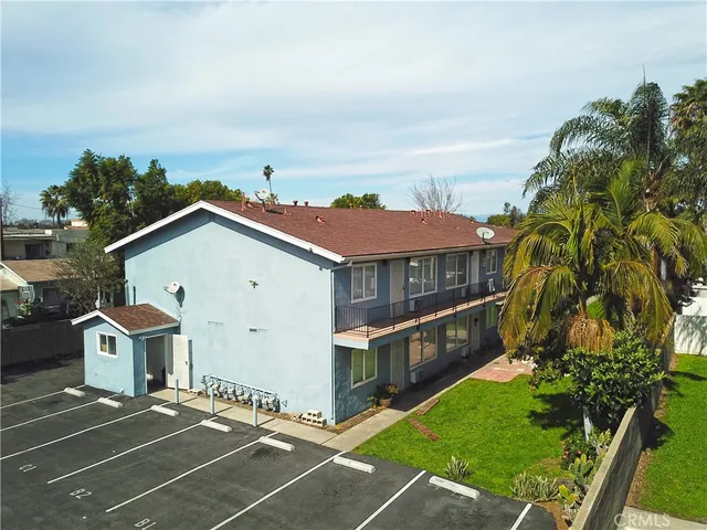 aerial view of a house with a yard