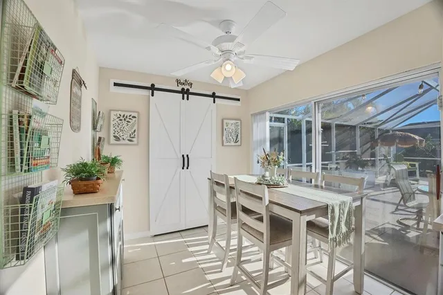 a dining room with furniture and window