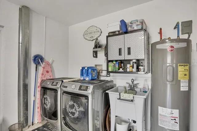 a kitchen with stainless steel appliances granite countertop a refrigerator and a stove