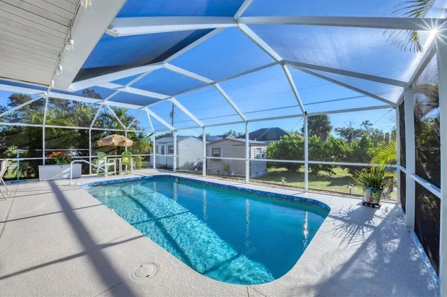 a view of a swimming pool with a patio